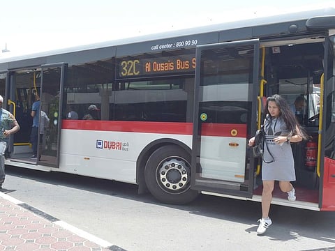 Commuters coming ouit of  RTA bus at the Satwa bus Station in Dubai