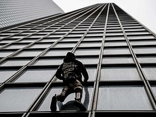French 'Spiderman' stages protest climb against pension reform