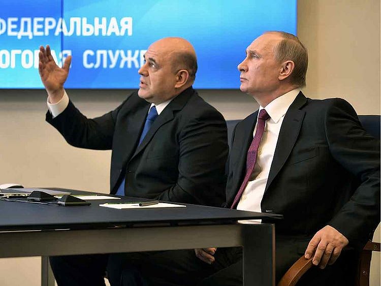 Russian President Vladimir Putin is seen with Mikhail Mishustin in Moscow, Russia in this file photo taken on April 11, 2017.  