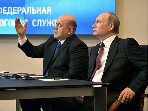 Russian President Vladimir Putin is seen with Mikhail Mishustin in Moscow, Russia in this file photo taken on April 11, 2017.  