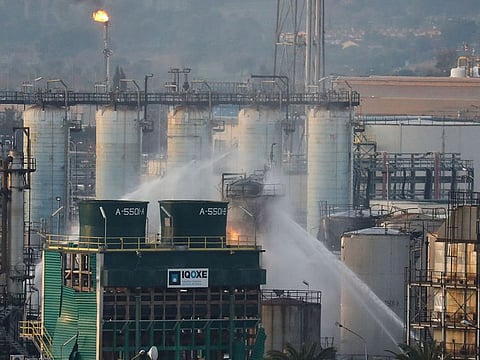 Firefighters spray water after a large fire broke out at the chemical factory, after explosion at a factory in the Tarragona, Spain January 15, 2020.