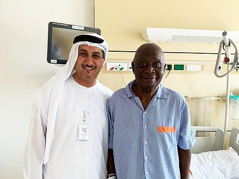 Dr Fahd Baslaib, interventional cardiologist and CEO of Rashid Hospital with the 82-year-old Nigerianpatient