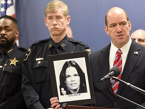 DuPage County state's attorney Robert Berlin holds up a photo of Debra McCall, a victim of an unsolved murder that they thought the suspect was Bruce Lindahl, as he spoke during a press conference in Wheaton, Ill., Monday, Jan. 13, 2020. 