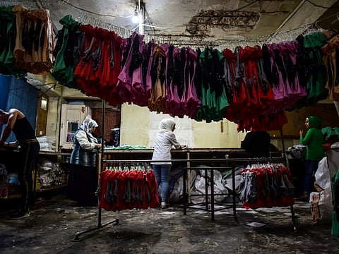 A small clothing factory that was flooded by calls from widows seeking work in Aleppo, Syria