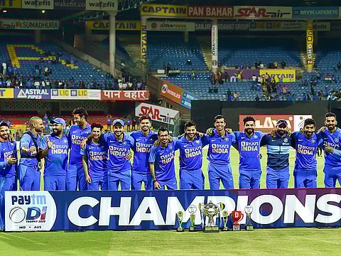 Indian team pose with trophy after they won the third and final ODI cricket match against  Australia at Chinnaswamy stadium in Bengaluru, on January 19, 2020. 