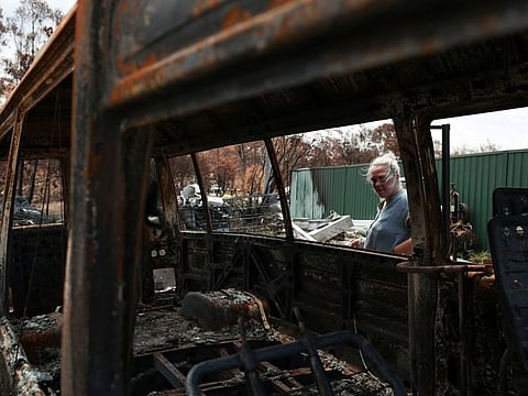 Alisha Stoneham returns to her property, where she was nearly caught in the flames before narrowly escaping, following the recent bushfires in New South Wales, Australia, January 21, 2020