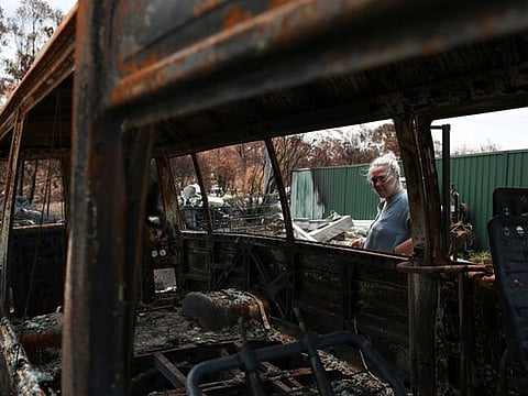 Alisha Stoneham returns to her property, where she was nearly caught in the flames before narrowly escaping, following the recent bushfires in New South Wales, Australia, January 21, 2020