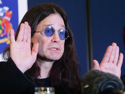 In this file photo taken on November 23, 2004, British rock star Ozzy Osbourne gestures during a Thames Valley Police press conference in Gerrards Cross, Britain,  after his house was broken into late 22 November.