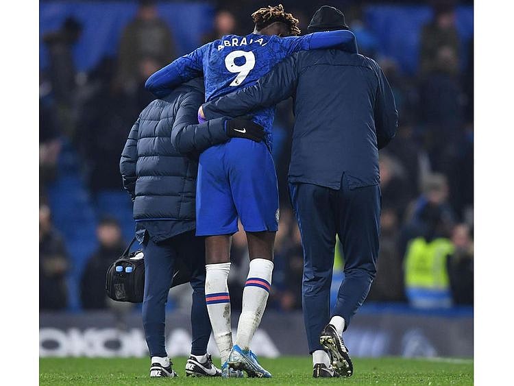 Tammy Abraham goes off injured during Chelsea's match with Arsenal.