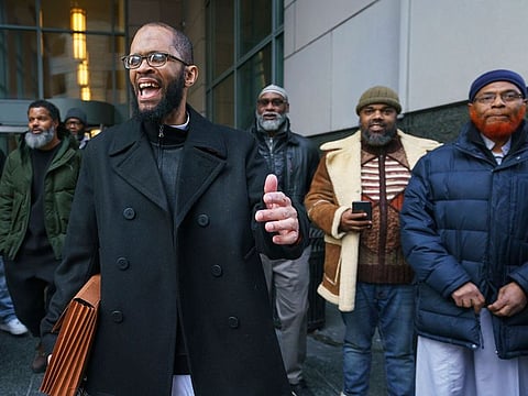 Theophalis Wilson, with friends and family behind him, walks out of the Criminal Justice Center in Philadelphia on Tuesday, Jan. 21, 2020, after being exonerated for a triple murder that took place when he was 17 years old, for which he served 21 years in prison.