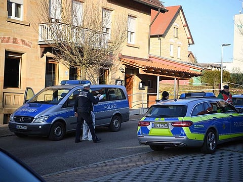 German police is seen outside a house where a shooter, believed to have a personal motive, launched an assault on January 24, 2020 in the town of Rot am See in southwestern Germany. 