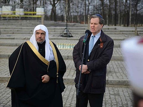 Dr. Mohammad Abdulkarim Al-Issa (L), Secretary General of the Muslim World League and American Jewish Committee (AJC) CEO David Harris (R) speak next to the memorial monument in the former German Nazi death camp Auschwitz-Birkenau on January 23, 2020.