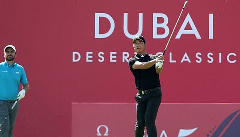 China's Wu Ashun in action during the third round  of Omega Dubai Desert Classic golf on Saturday.
