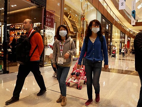 Residents wearing masks at a mall in Dubai on Sunday 