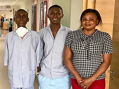 Jehozadak (left) with his donor brother and wife after successful bloodless liver transplant surgery in Bangalore, India.