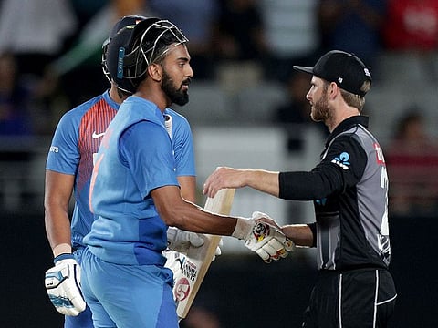 India’s Lokesh Rahul (L) speaks to New Zealand’s captain Kane Williamson (R) after winning the second Twenty20 at Eden Park in Auckland on January 26, 2020. 