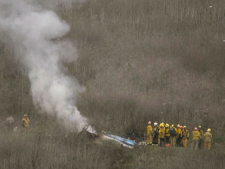 LA county firefighters on the scene of a helicopter crash that reportedly killed Kobe Bryant in Calabasas on Sunday. 