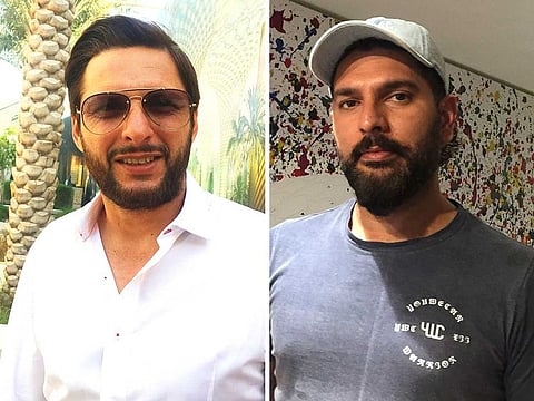 Legendary allrounders Shahid Afridi (L) and Yuvraj Singh (R) who are here to watch the finals of for Expo 2020 cricket tournament
