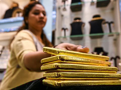 Piling up the gold bars at the Meena Jewellers outlet in Gold Souq. 