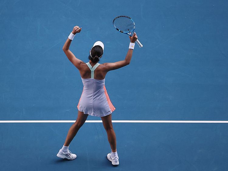 Spain's Garbine Muguruza celebrates after beating Romania's Simona Halep.