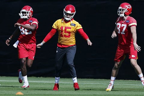 Kansas City Chiefs tight end Deon Yelder (82), quarterback Patrick Mahomes (15) and tight-end Travis Kelce (87) stretch during practice on Thursday on the eve of NFL Super Bowl 54 showdown.