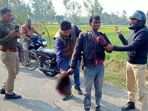 Man holding wife's severed head went to police station.