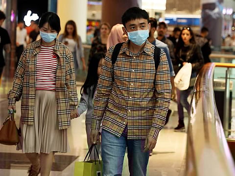 Due to recent threats of the Coronavirus, Chinese tourists in Dubai Mall wear masks to contain the virus from spreading. Picture taken on 26th January, 2020. 