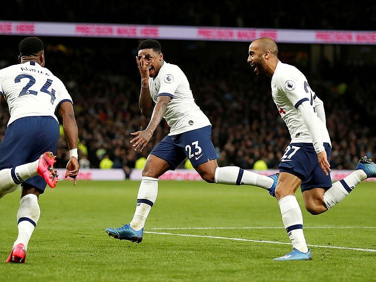 Tottenham Hotspur's Steven Bergwijn celebrates scoring their first goal with Serge Aurier and Lucas Moura
