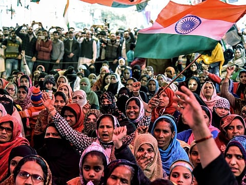 Women shout slogans against India's new citizenship law during a protest at Shaheen Bagh near the Jamia Millia Islamia university in New Delhi.