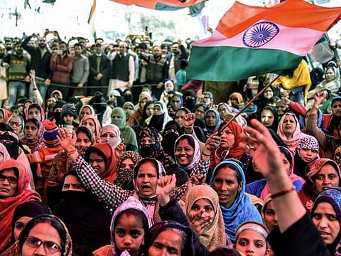 Women shout slogans against India's new citizenship law during a protest at Shaheen Bagh near the Jamia Millia Islamia university in New Delhi.