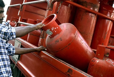 Gas delivery man delivers gas Photo Clint Egbert/Gulf News