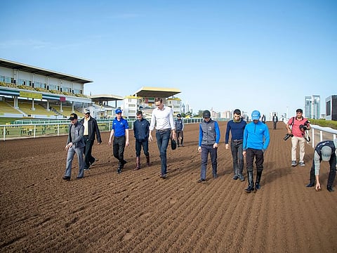 Officials from the ERA led by Chief Steward Sam Shinsky assessing the track condition at Jebel Ali Racecourse