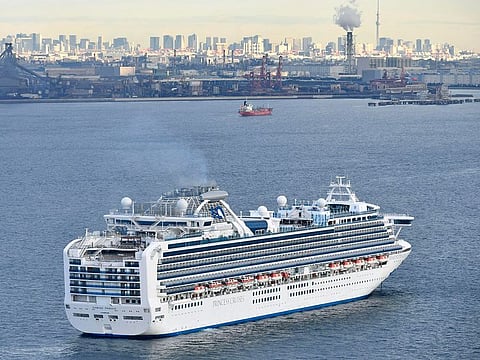 A cruise ship Diamond Princess anchor off the Yokohama Port upon arrival in Yokohama, near Tokyo Tuesday, Feb. 4, 2020. 