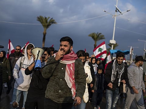 Jad Jarjoui, a protester who volunteered with Hezbollah in Syria for a few months and is now unemployed, with demonstrators in Tyre, Lebanon, Jan. 19, 2020.