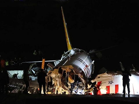Firefighters and rescue teams are seen next to the wreckage of a plane after it crashed at Sabiha Gokcen airport in Istanbul, Turkey, February 5, 2020. 