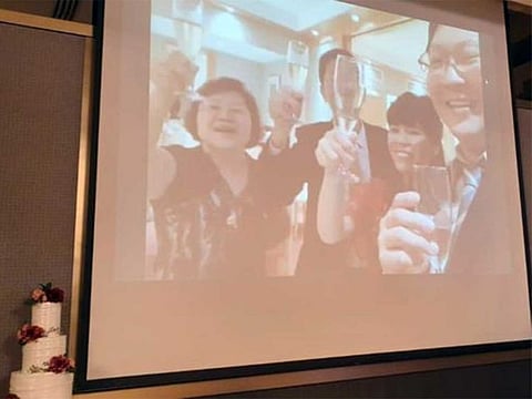  The wedding couple and their parents gave a toast to the room via livestream