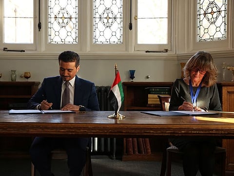 Ahmed bin Rakkad Al Ameri, Chairman ofSharjah Book Authority, and CILIP President Professor Judith Broady-Preston sign the agreement