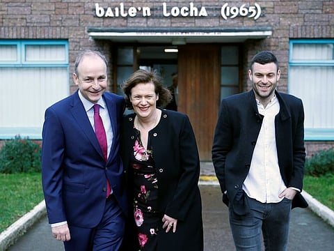 Fianna Fail leader Micheal Martin and his family leave after casting their votes in Ireland's national election in Cork, Ireland, February 8, 2020. 