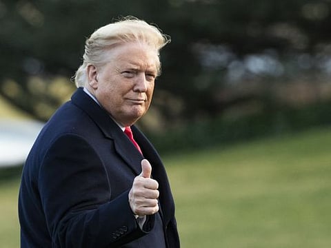 President Donald Trump gestures as he arrives back to the White House on February 7, 2020, in Washington, from a trip in Charlotte, North Carolina.