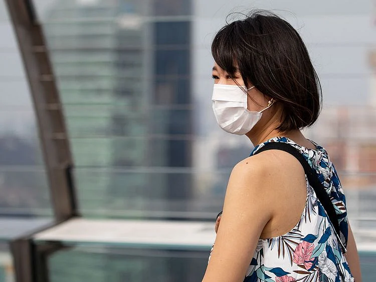 A woman wearing a protective mask