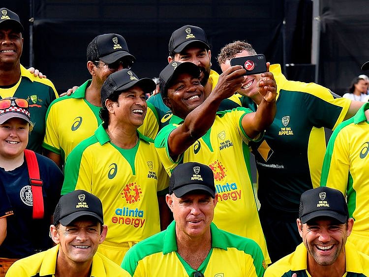 Sachin Tendulker smiles for a selfie with Brian Lara
