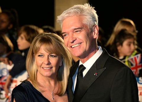 Television presenter Phillip Schofield arrives with his wife Stephanie Lowe for the Pride of Britain Awards in London, Britain October 30, 2017.