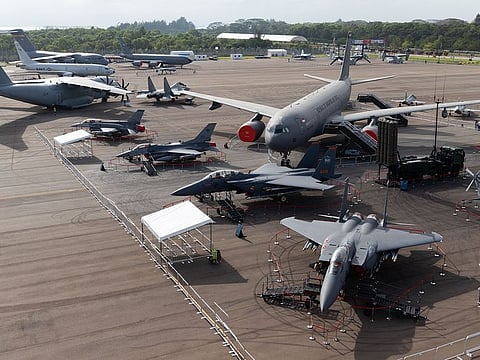 Military aircraft stand on display during a media preview day at the Singapore Airshow held at the Changi Exhibition Centre in Singapore, on Sunday. 