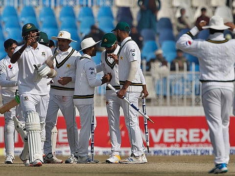 Pakistan players celebrate after winning the first Test against Bangladesh in Rawalpindi 