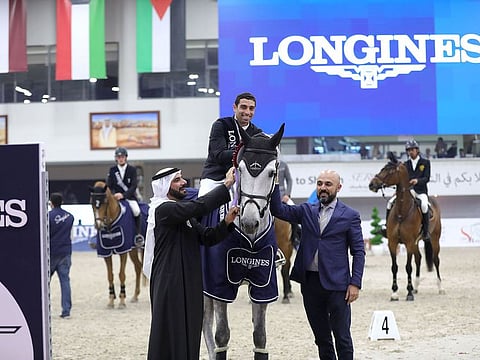 Patrick Aoun, Regional Brand Manager of Longines, right, principal sponsor of the HH Sharjah Grand Prize and Sultan Al Yahyaee, General Manager of Sharjah Equestrian & Racing Club and Championship Manager, left, with Egypt's Abdel Said  