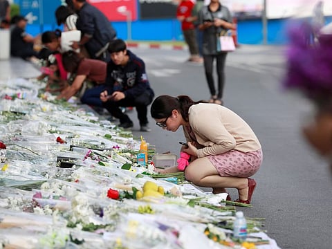 People put flowers and write memoirs in front of Terminal 21 shopping mall after a shooting in Nakhon Ratchasima, Thailand on February 10, 2020.