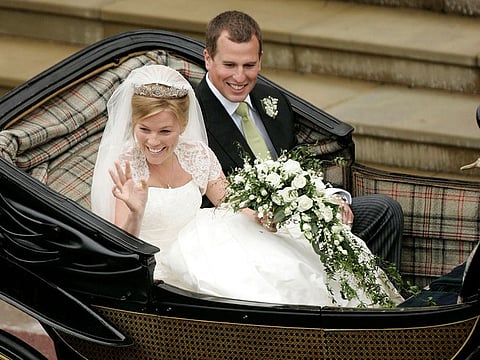Britain's Peter Phillips (R) and Canada's Autumn Kelly leave St George's Chapel after their marriage in Windsor, southern England on May 17, 2008. 