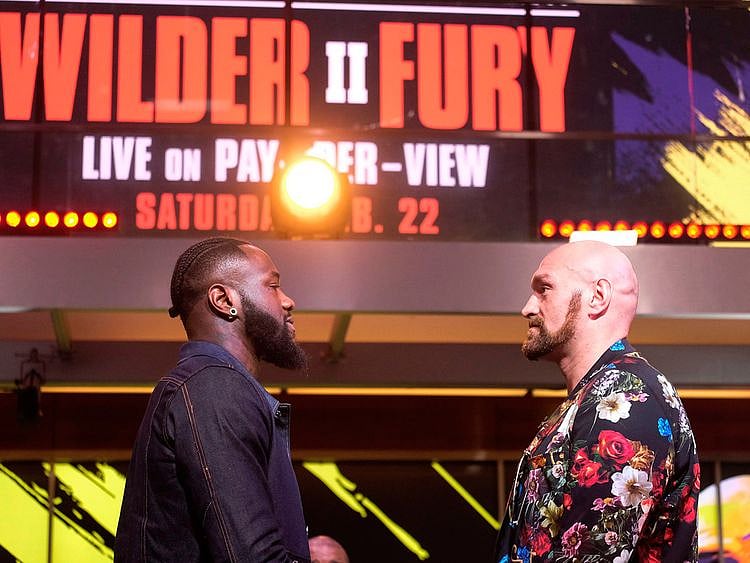 Deontay Wilder and Tyson Fury face-off during a press conference in Los Angeles