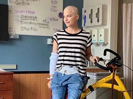 Actor Selma Blair, who has battled multiple sclerosis (MS), poses with an Alinker 'walking bike', a mobility device for people with disabilities, in an unknown location in this undated handout photo.