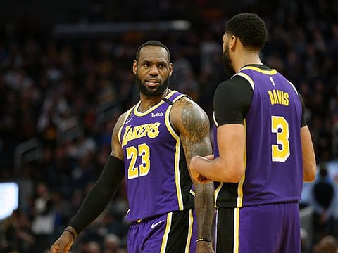 Los Angeles Lakers forward LeBron James (23) talks with centre Anthony Davis
